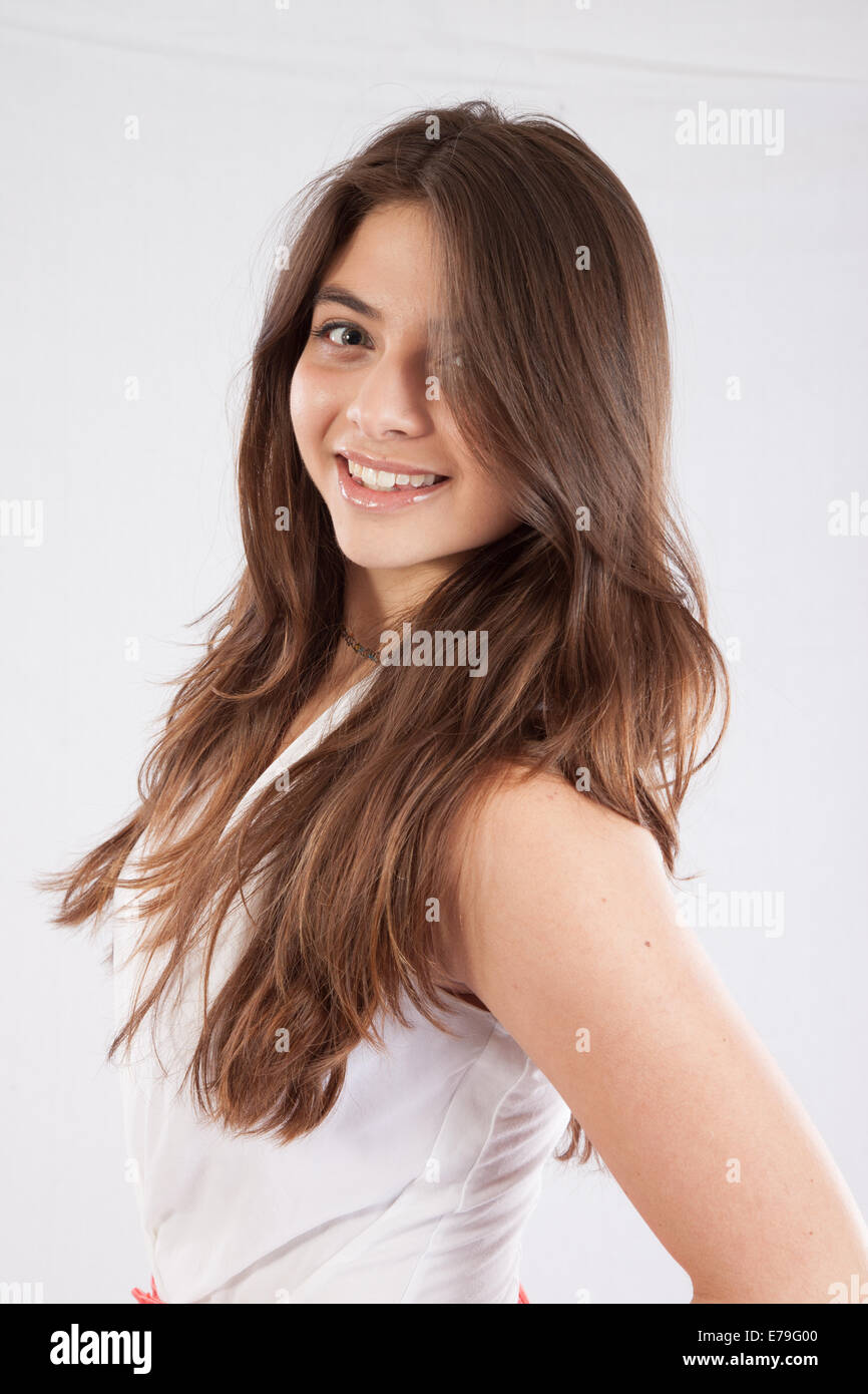 Pretty Caucasian woman with long hair,  smiling at the viewer with a friendly smile Stock Photo