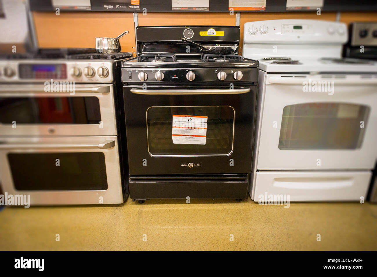 A General Electric Gas Stove Center Is Seen With Other Brands In