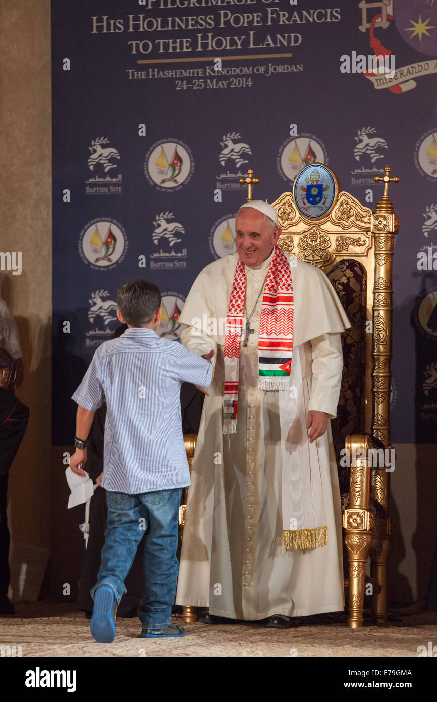 Pope Francis meets a Syrian refugee during his visit to the Catholic church at the Baptism Site, at the River Jordan, Jordan. Stock Photo