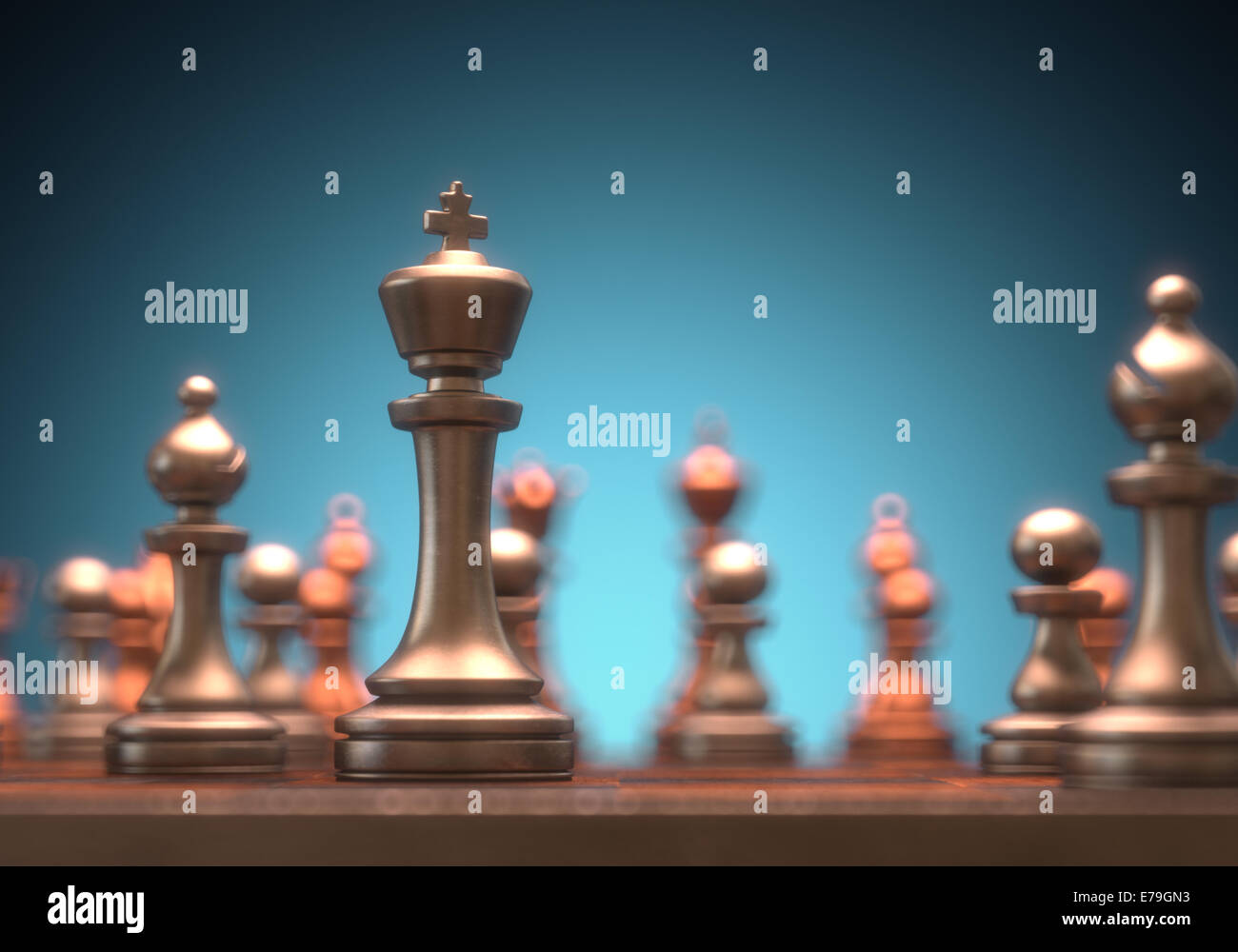 Chessboard with pieces of metal in depth of field view. Clipping path on the King piece. Stock Photo