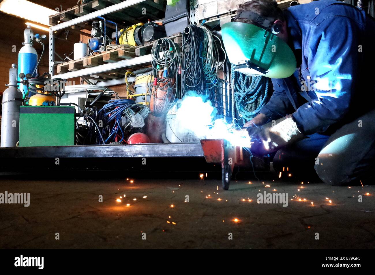 Welder in work with welding in the workshop Stock Photo