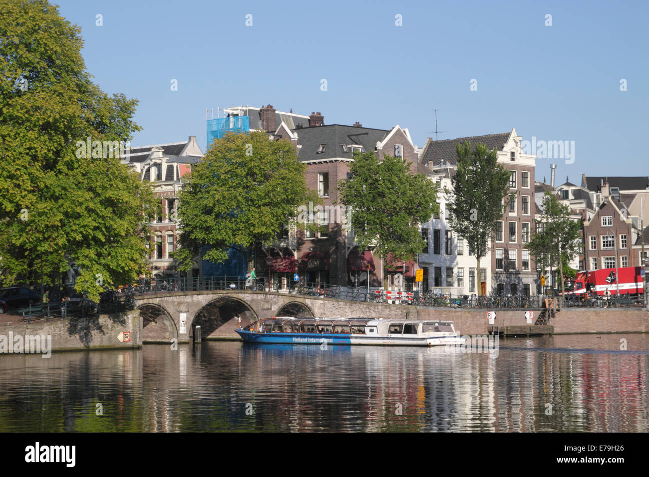 Amstel River and Bridge at entrance to Herengracht Canal Amsterdam Stock Photo