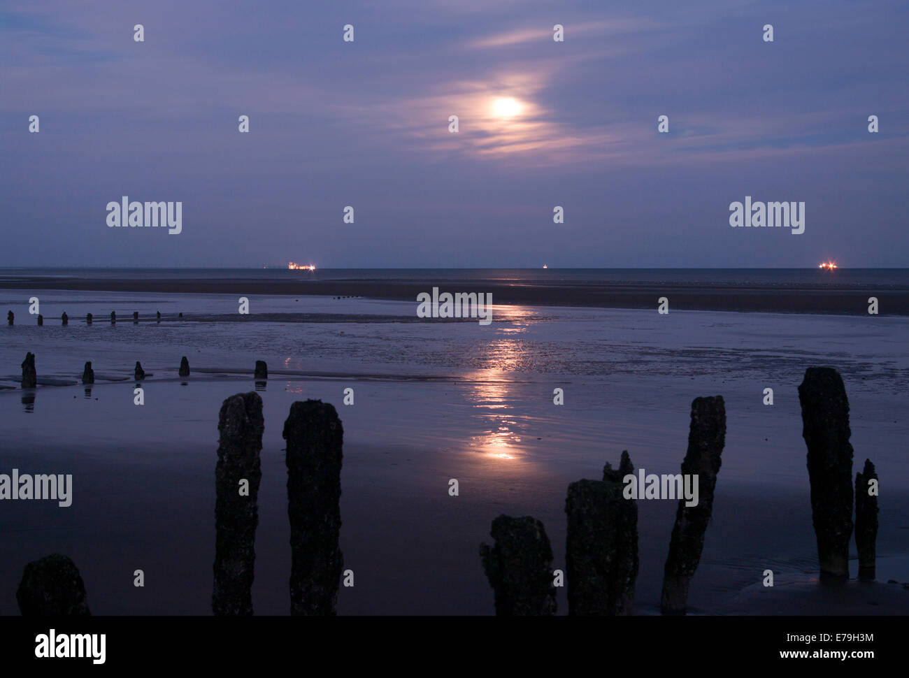 The Moon Reflecting at Low Tide at Winchelsea Beach east Sussex England