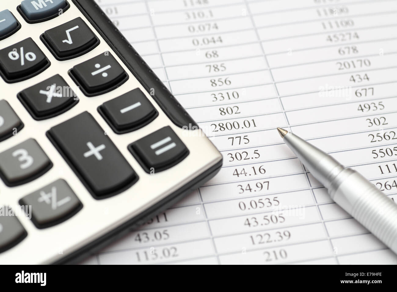 Financial statements. Calculator, ballpoint pen on financial statements. SDOF. Close-up. Stock Photo