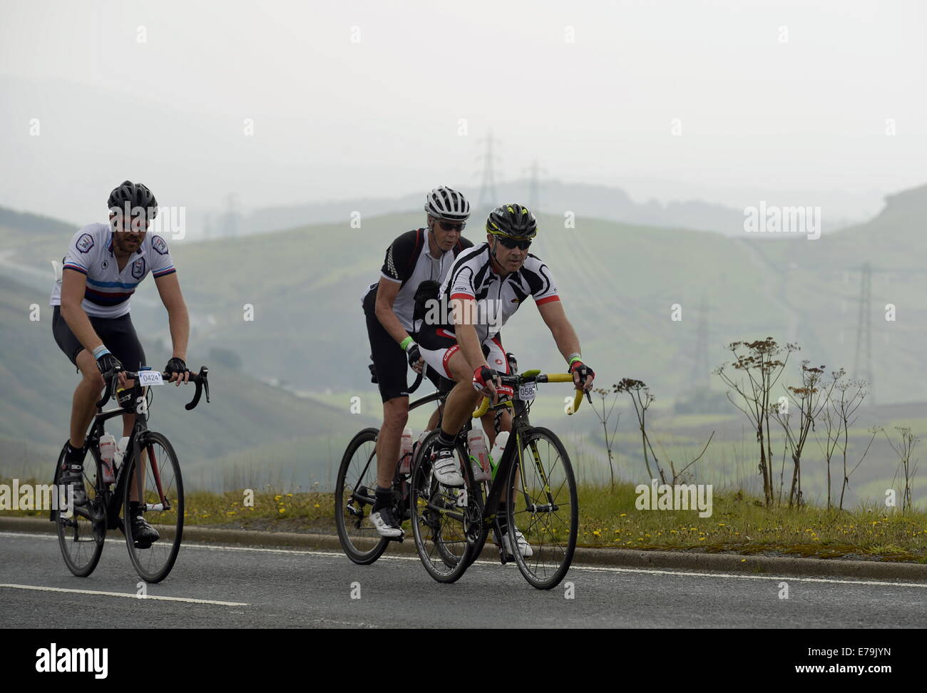 Cumbria, UK. 10th Sep, 2014. UK road cycling. Day Five of the Deloitte Ride Across Britain. Riders tackle the climb up Shap Fell on the A6 in Cumbria. The 104 mile stage started at Haydock Park and ended at Hutton in the Forrest near Penrith, Cumbria: 10 September 2014  Credit:  STUART WALKER/Alamy Live News Stock Photo