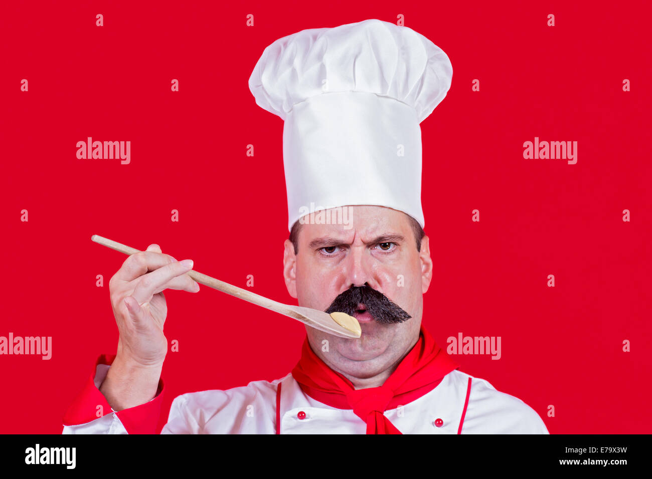 https://c8.alamy.com/comp/E79X3W/chef-tasting-the-food-from-wooden-spoons-E79X3W.jpg