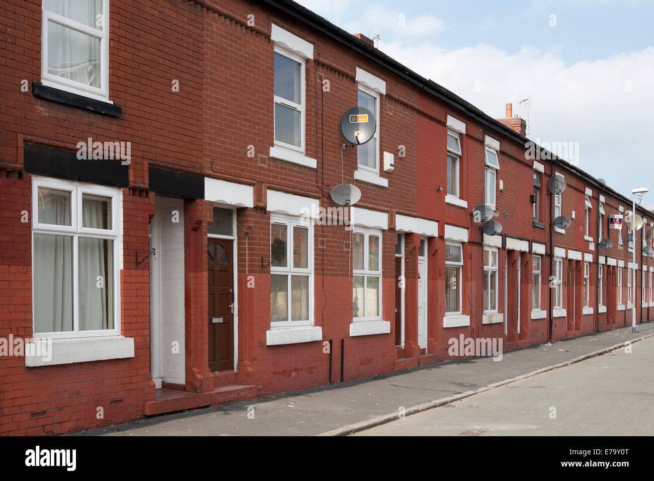 A street of terraced houses in the Moss Side area of Manchester