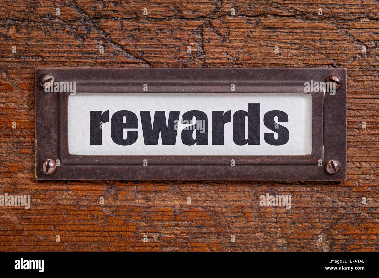rewards - file cabinet label, bronze holder against grunge and ...