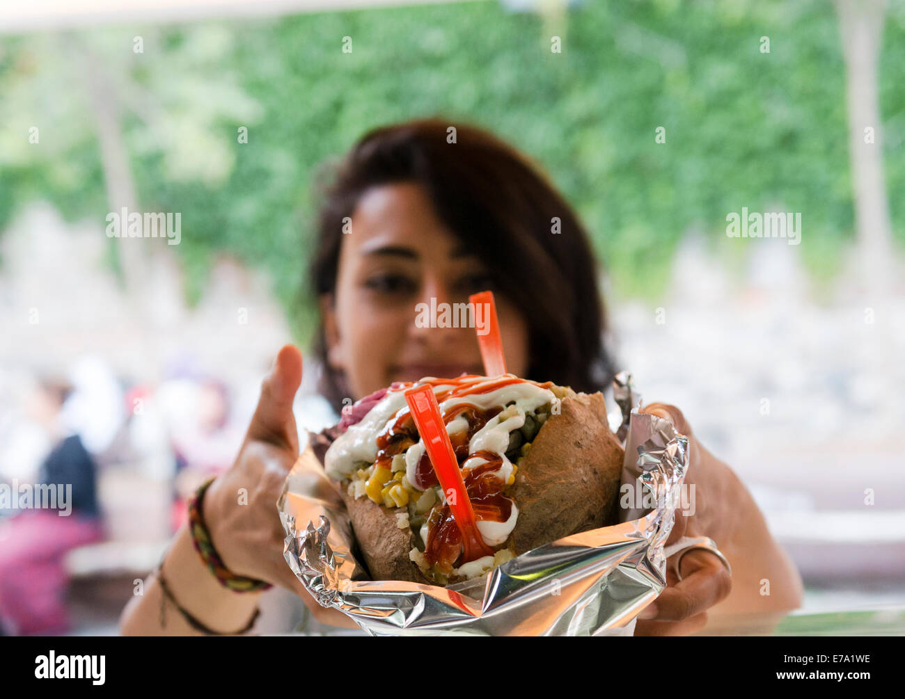 Kumpir- Istanbul style of baked potato stuffed with different fillings. Stock Photo