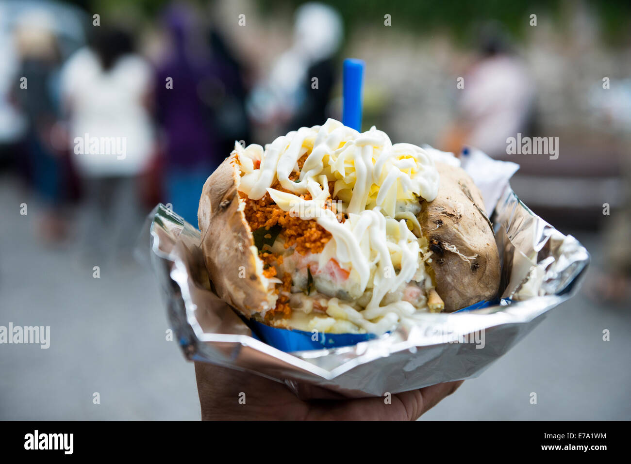 Kumpir- Istanbul style of baked potato stuffed with different fillings. Stock Photo