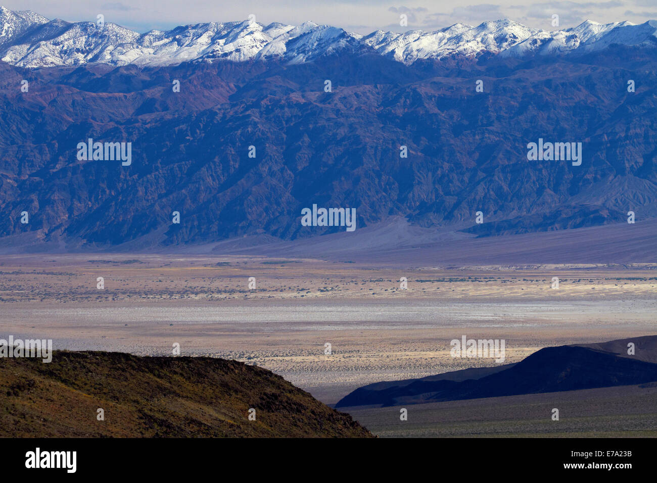 Death Valley near Stovepipe Wells, and snow on Grapevine Mountains, Death Valley National Park, Mojave Desert, California, USA Stock Photo