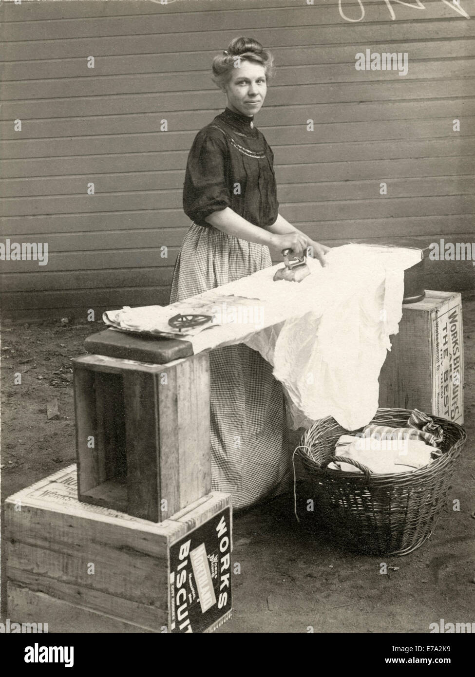 Woman Ironing Clothes, Minneapolis, Minnesota, USA, circa 1910 Stock Photo