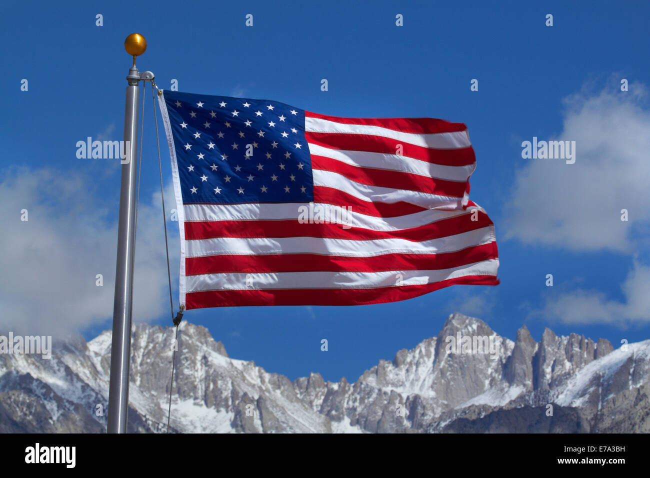 American flag and snow on Sierra Nevada Mountain Range, California, USA Stock Photo