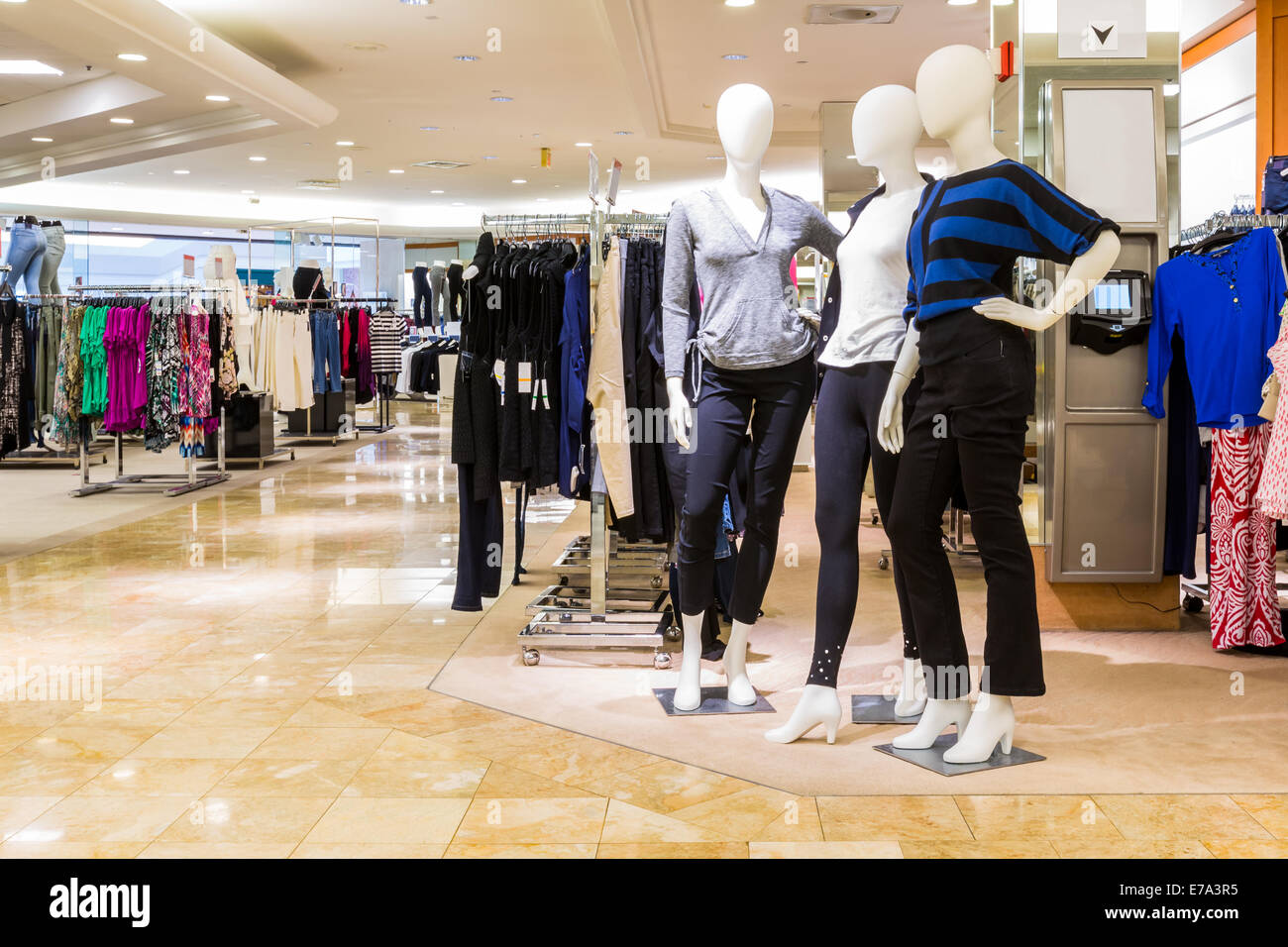 Interior of a fashion and designer clothing store. Stock Photo