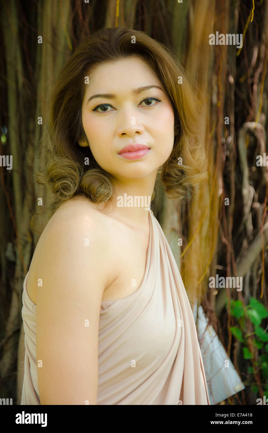 portrait of woman relax under the tree Stock Photo