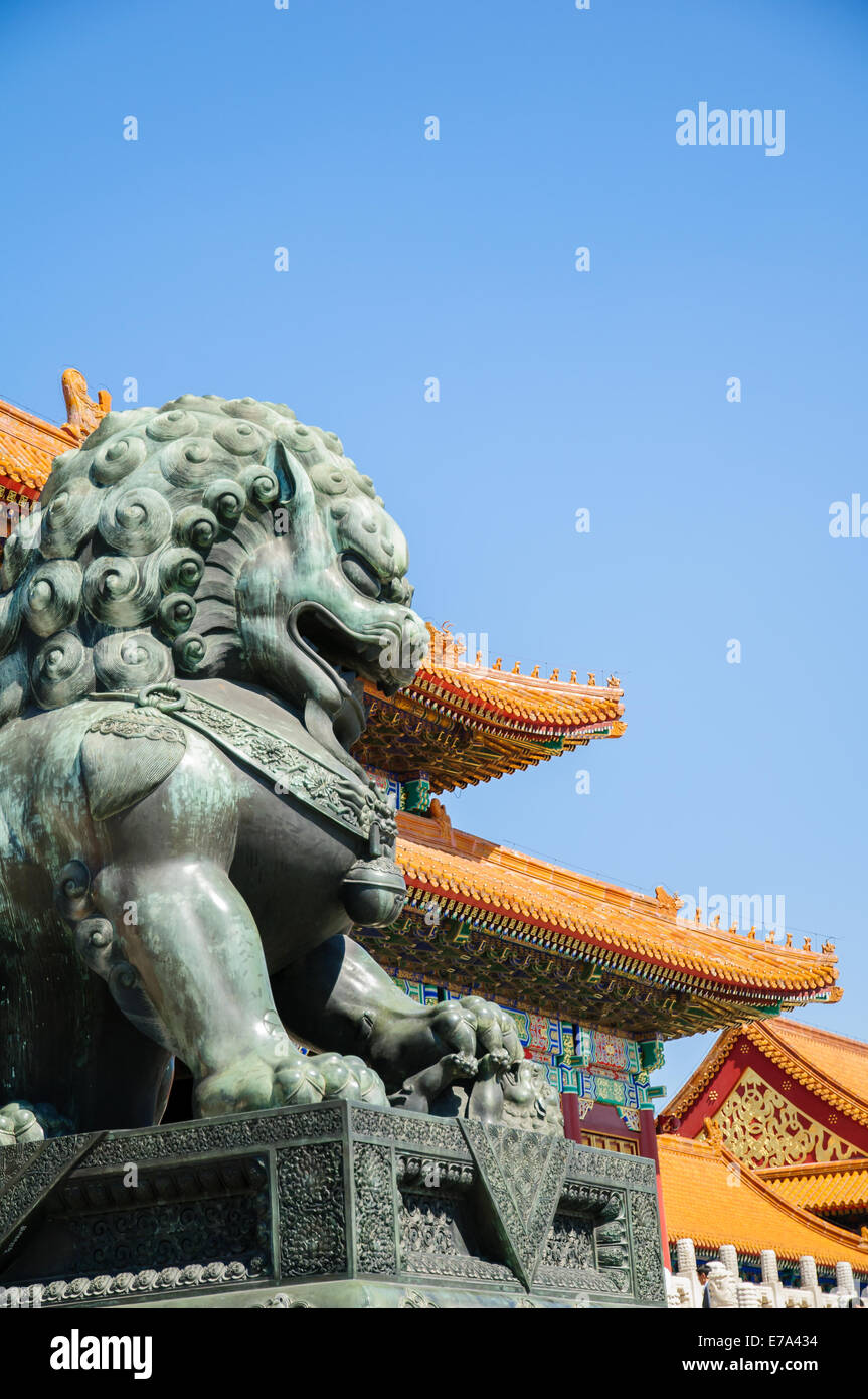 Lion statue and temple in Forbidden City, Beijing, China Stock Photo