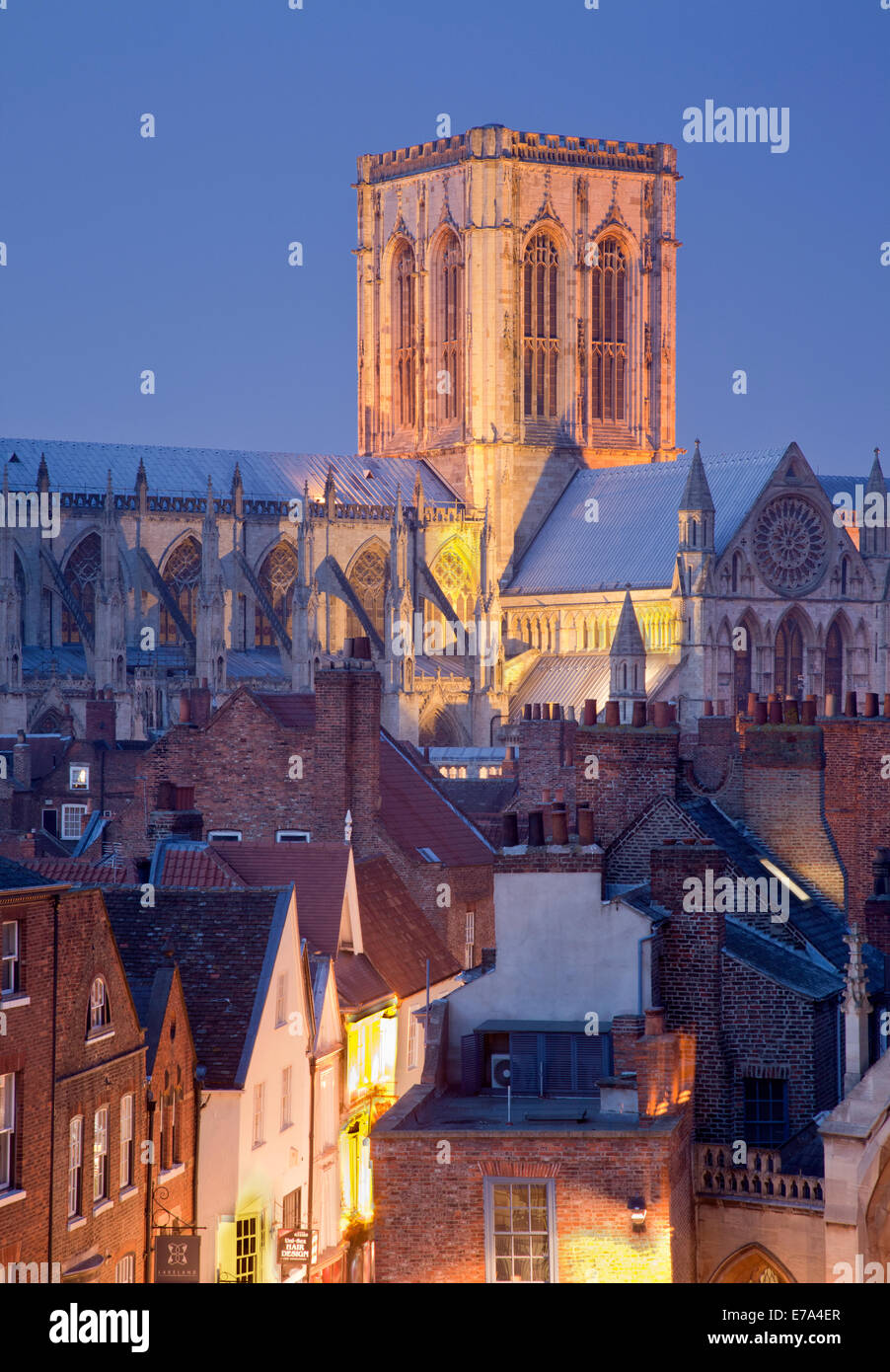 York Minster illuminated at dusk and Stonegate rooftops photographed from the Mansion House roof, in York, England. Stock Photo