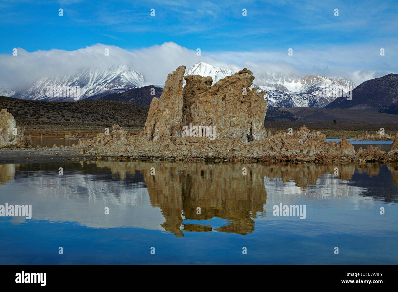 Limestone tufa towers at South Tufa Reserve, Mono Lake, Mono County, and snow on Sierra Nevada Mountain Range, California, USA Stock Photo