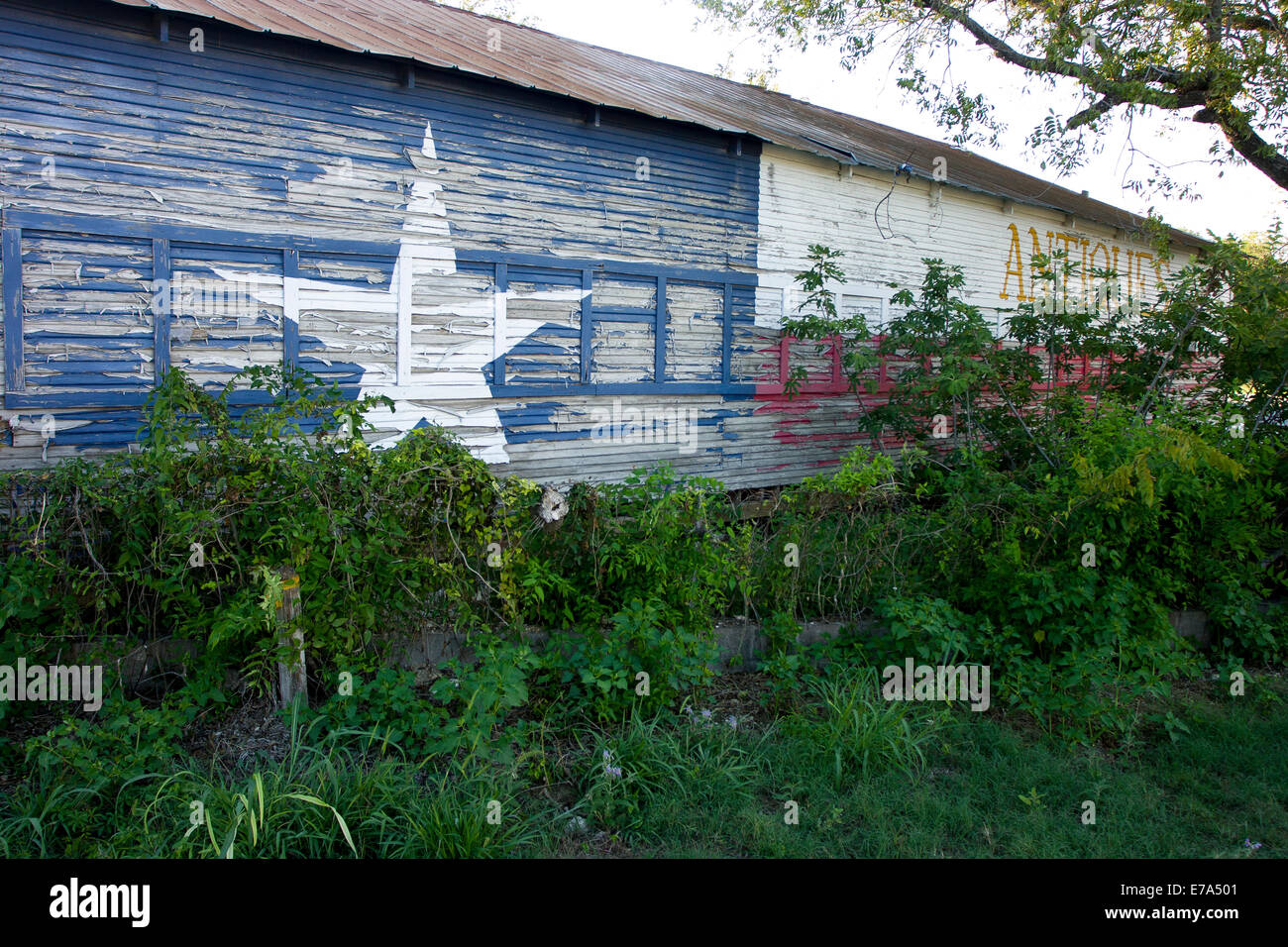 Abandoned antique store with Texas flag paint, Pipe Creek Texas Stock ...