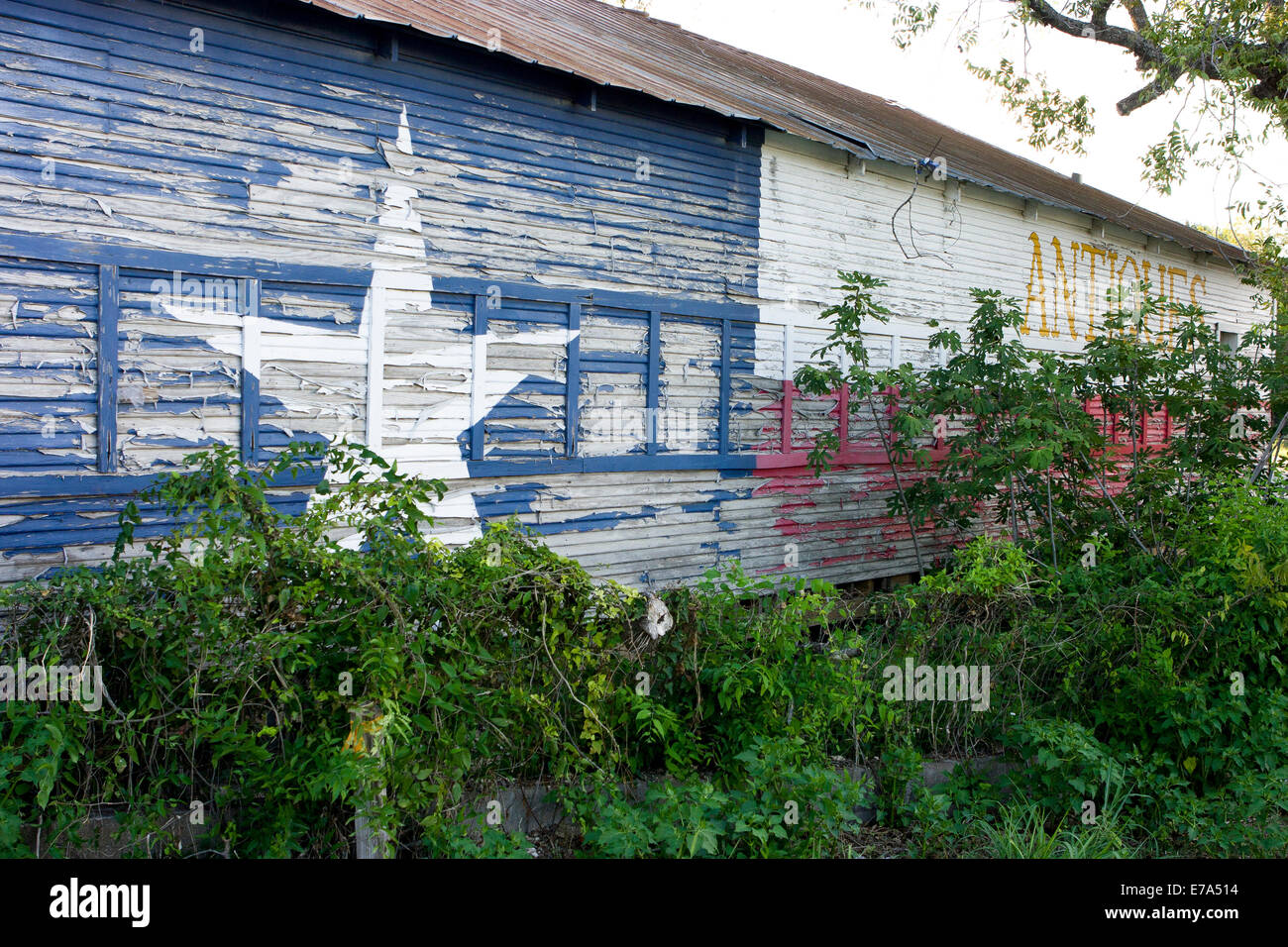 Abandoned antique store with Texas flag paint, Pipe Creek Texas Stock ...
