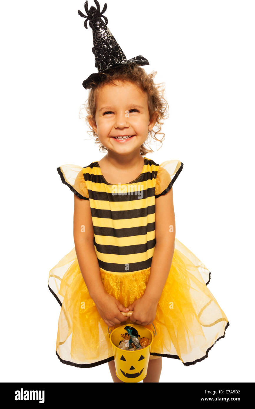Little bee costume with candy Halloween bucket Stock Photo