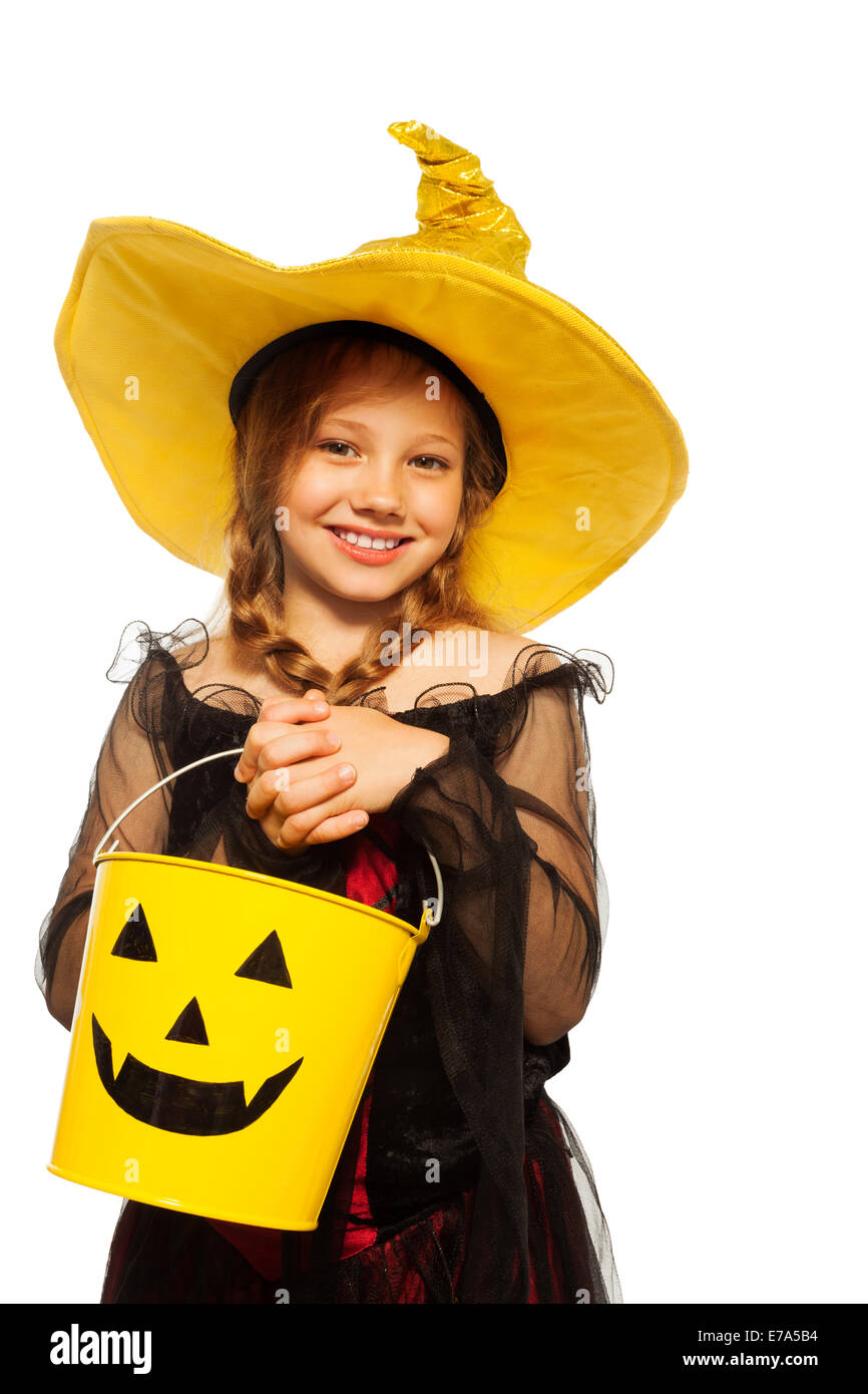 Girl in witch costume and spooky Halloween bucket Stock Photo Alamy