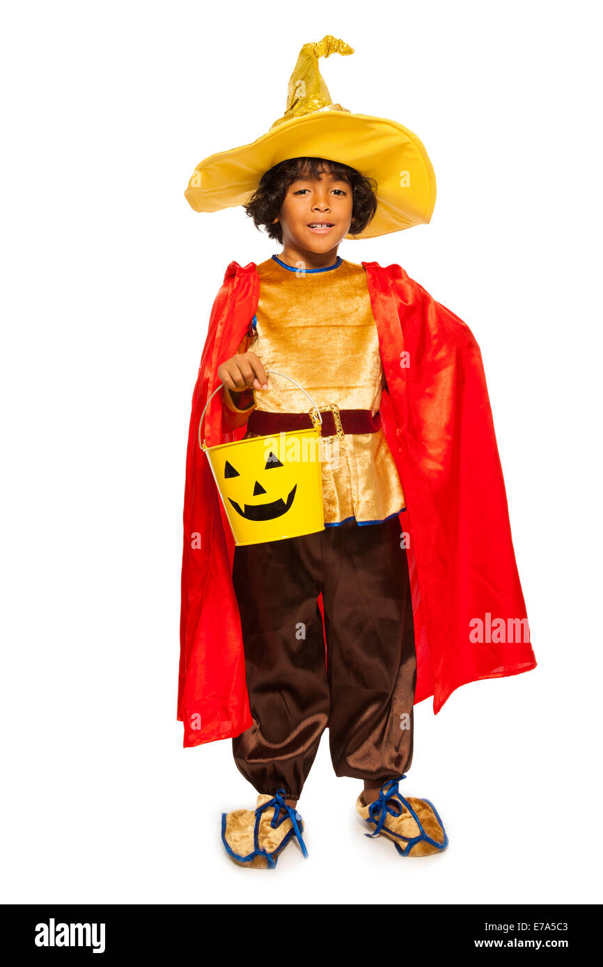 Boy in Halloween costume with candy bucket Stock Photo