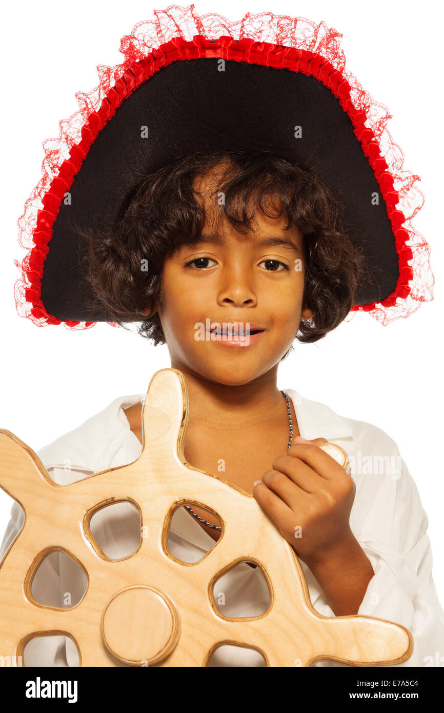 Portrait of a boy playing pirate steering helm Stock Photo