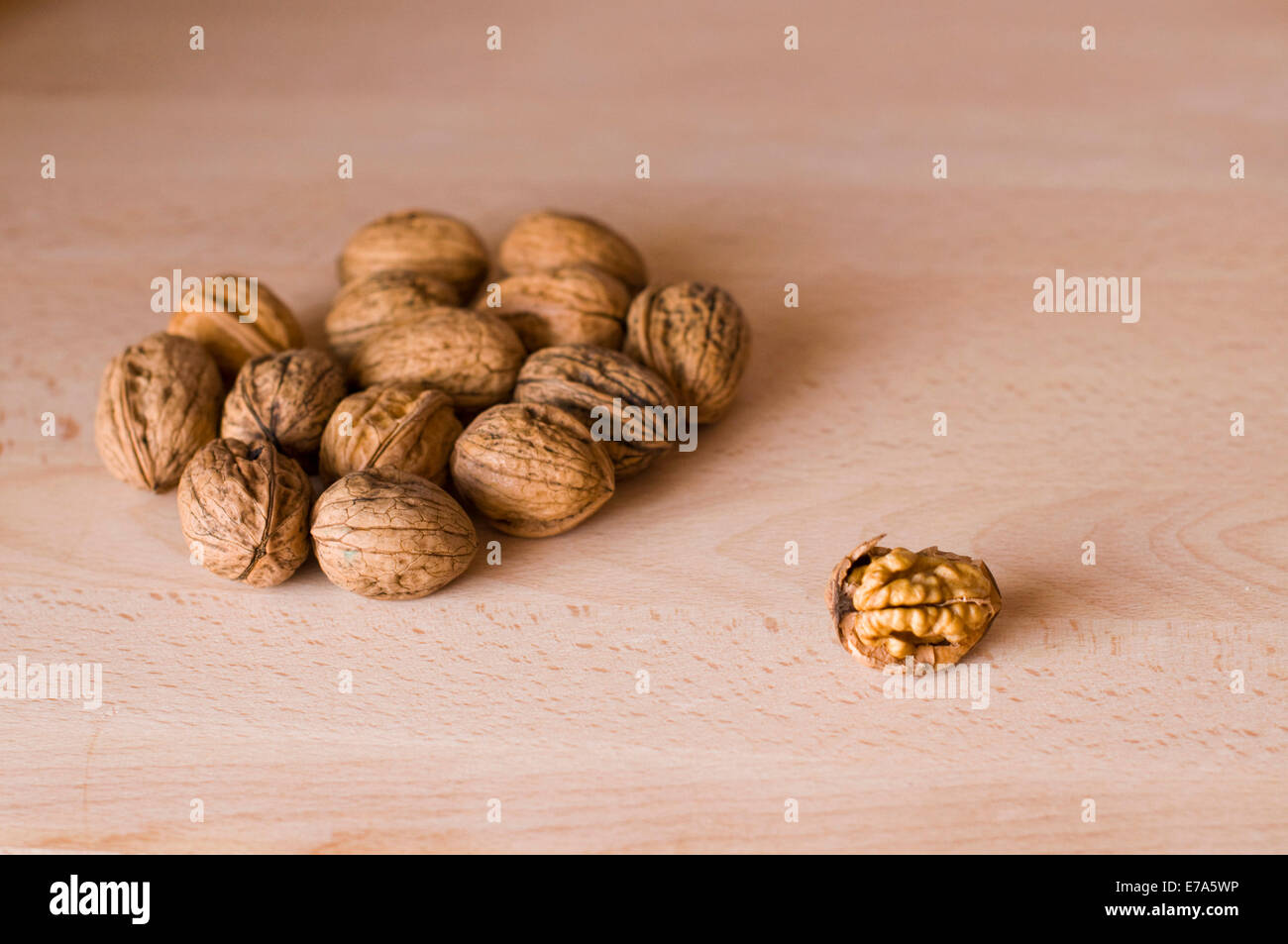 Dried fruit and nuts. Some walnuts over a wood table Stock Photo