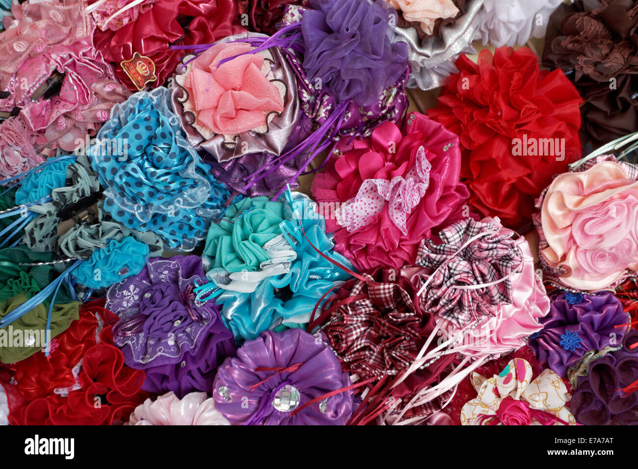 Colourful hair clips in a shop in the Muttrah Souq market, Muttrah, Muscat, Oman Stock Photo
