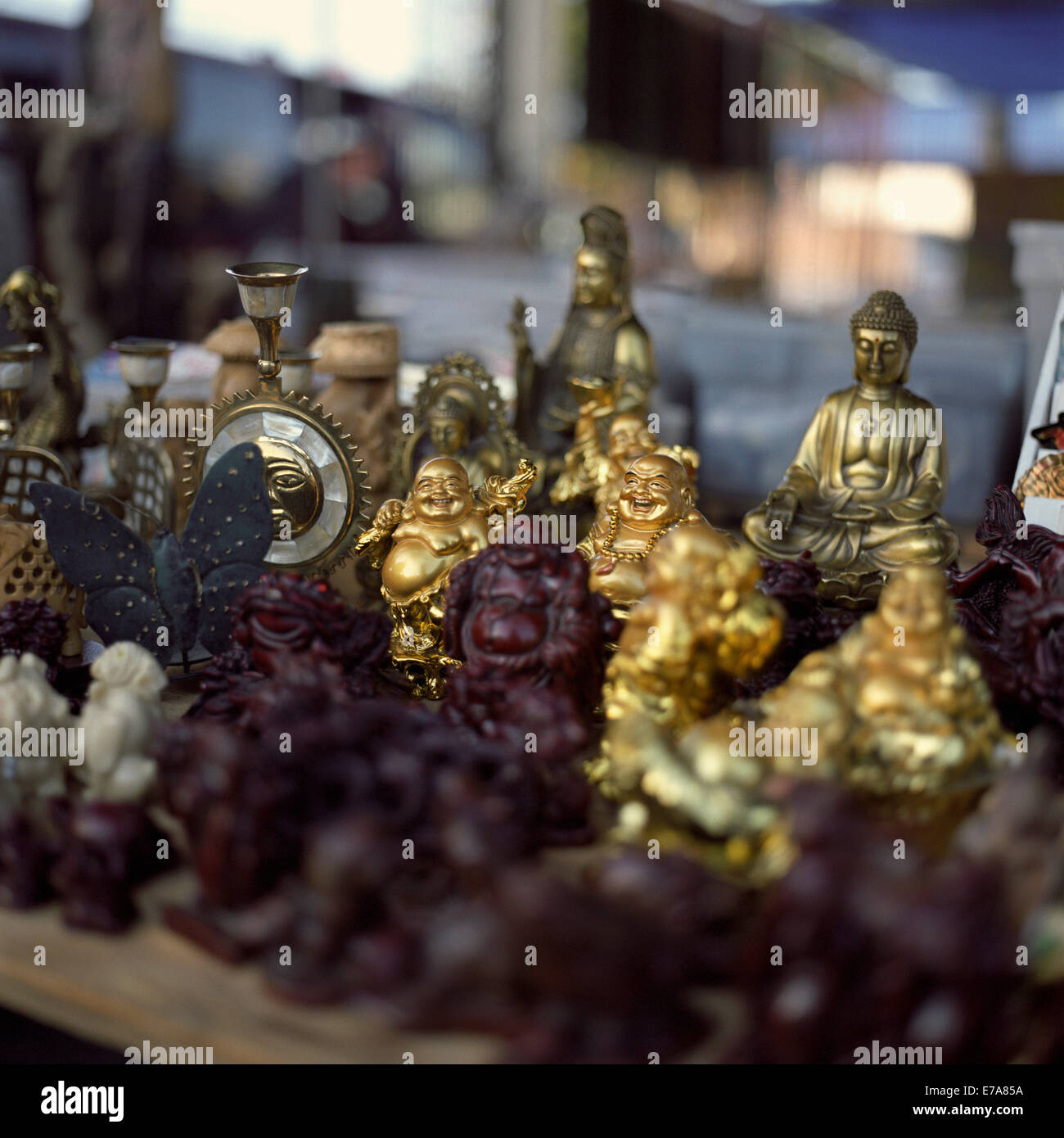 A collection of various Buddha statues for sale at a flea market Stock Photo