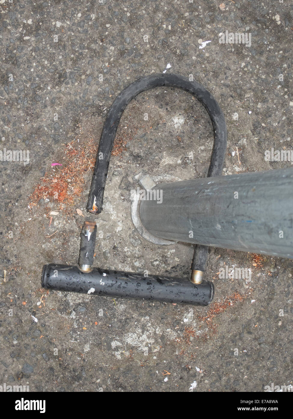 High angle view of broken bicycle lock in pole Stock Photo