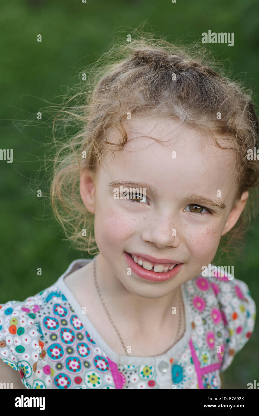 Portrait of cute girl smiling outdoors Stock Photo - Alamy