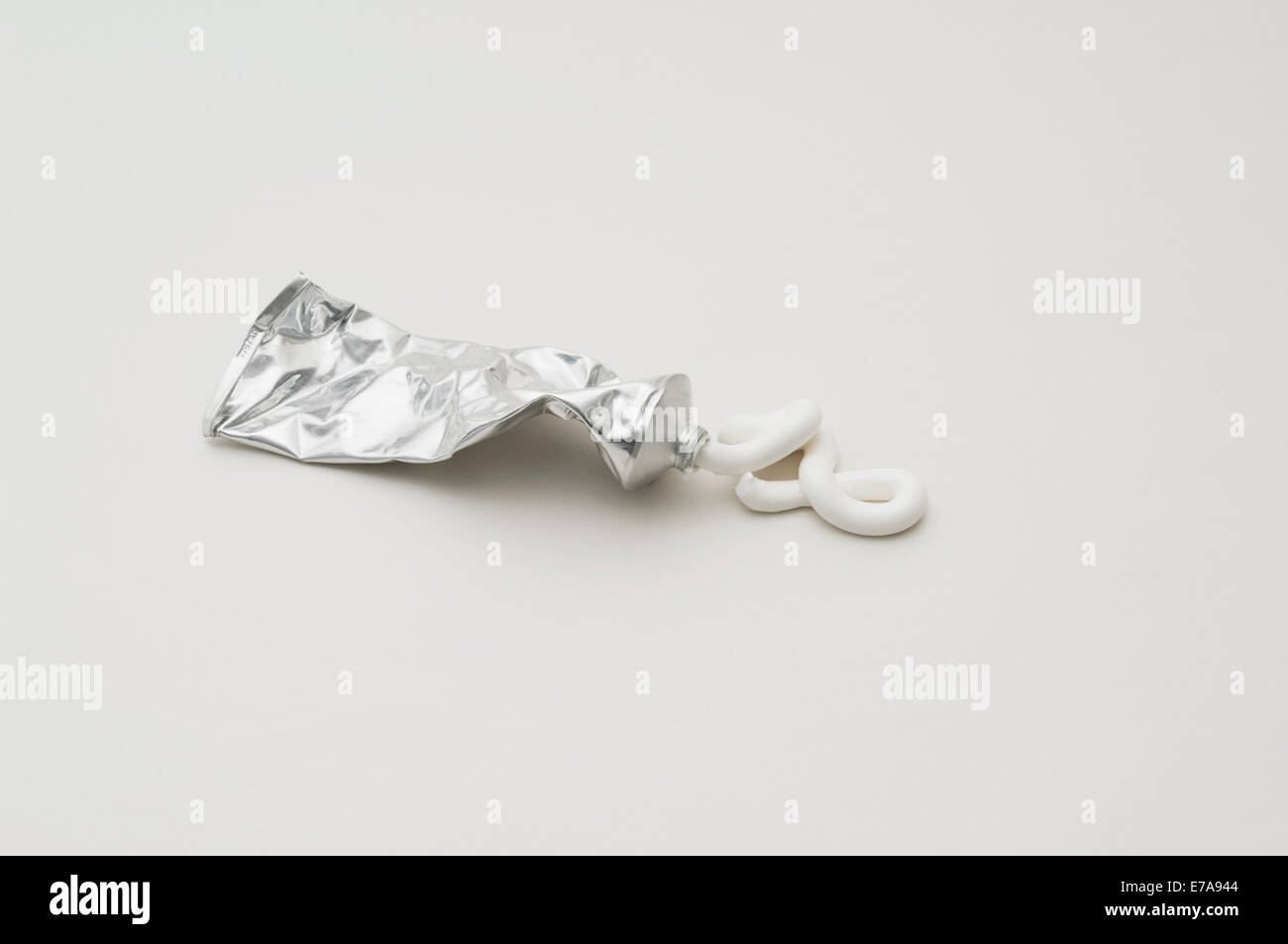Toothpaste squeezed out of tube over white background Stock Photo Alamy