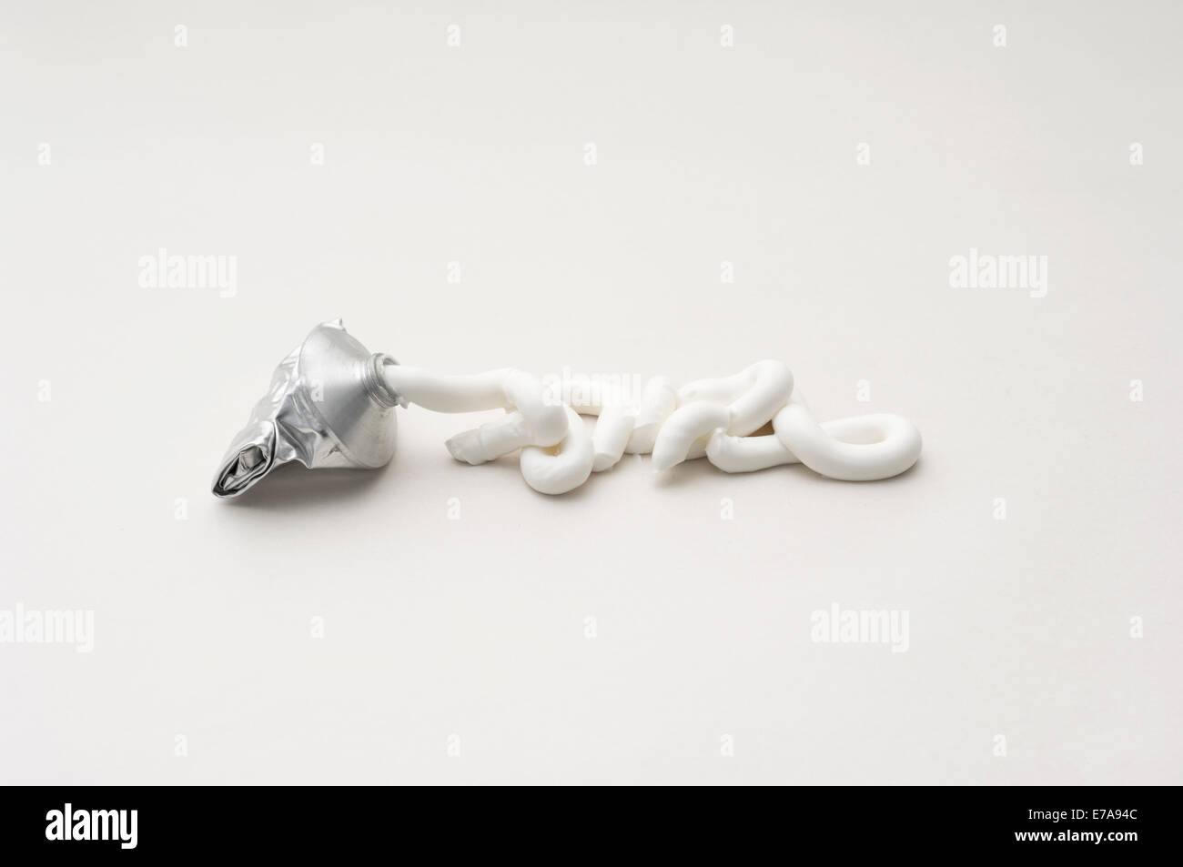 Toothpaste squeezed of tube against white background Stock Photo Alamy