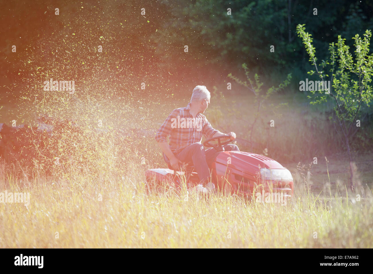 Mature man sitting in garden hi-res stock photography and images - Alamy