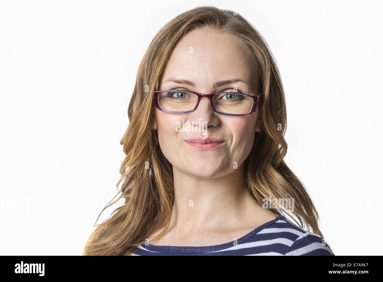 Portrait of woman smiling against white background Stock Photo - Alamy