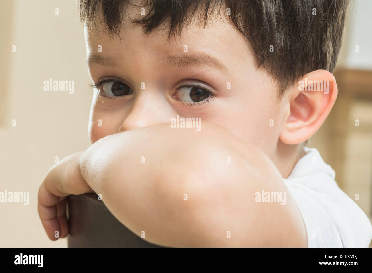 Close-up portrait of cute boy at home Stock Photo