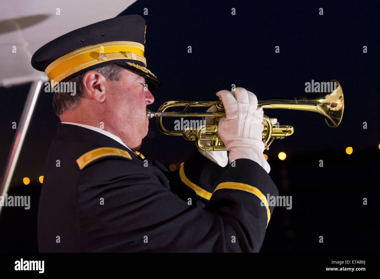 Freeport, New York, USA. 10th Sep, 2014. A bugler plays taps at night