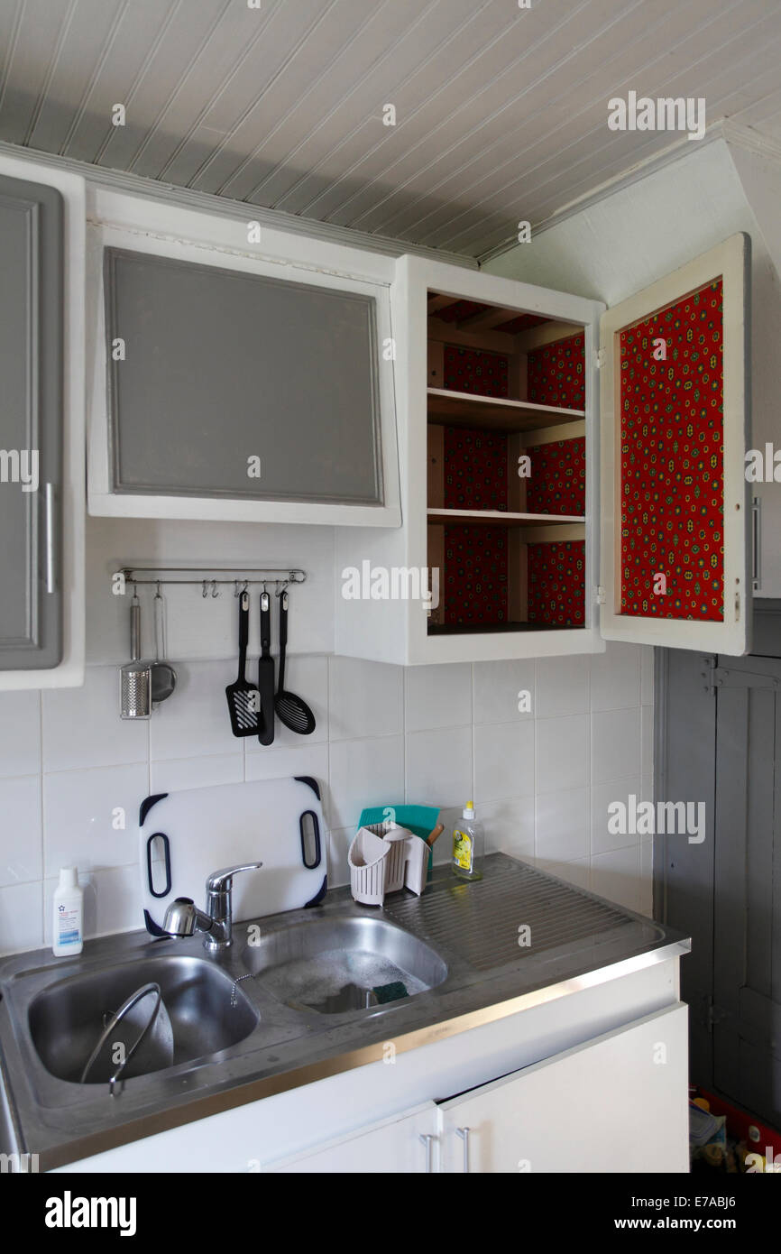 vintage kitchen cupboard with red fablon inside Stock Photo Alamy