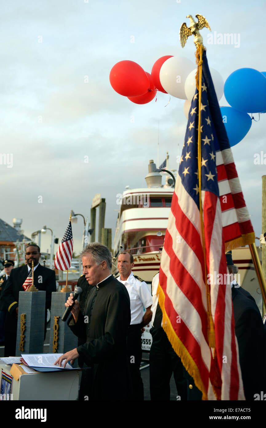 Freeport, New York, USA. 10th Sept. 2014. A pastor gives a blessing at