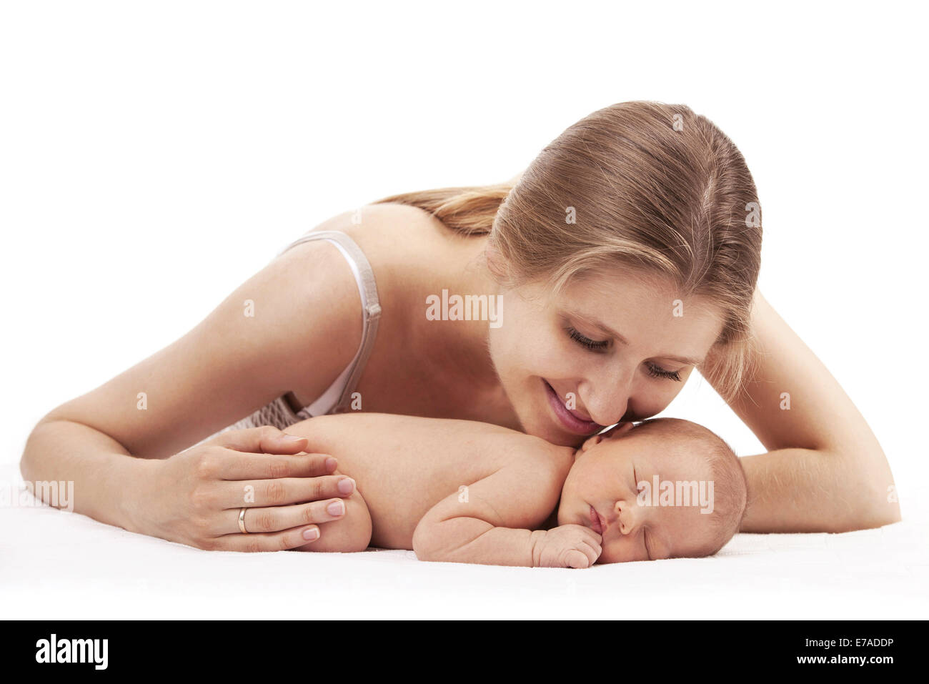 Portrait of young mother and newborn son over white background Stock Photo