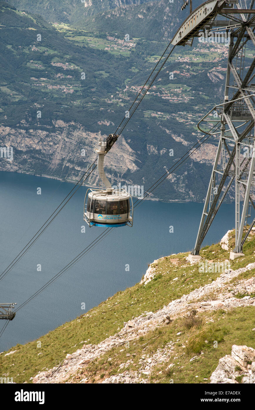 The Monte Baldo cable car climbs up the mountain from Malcesine above Lake Garda in Northern Italy Stock Photo