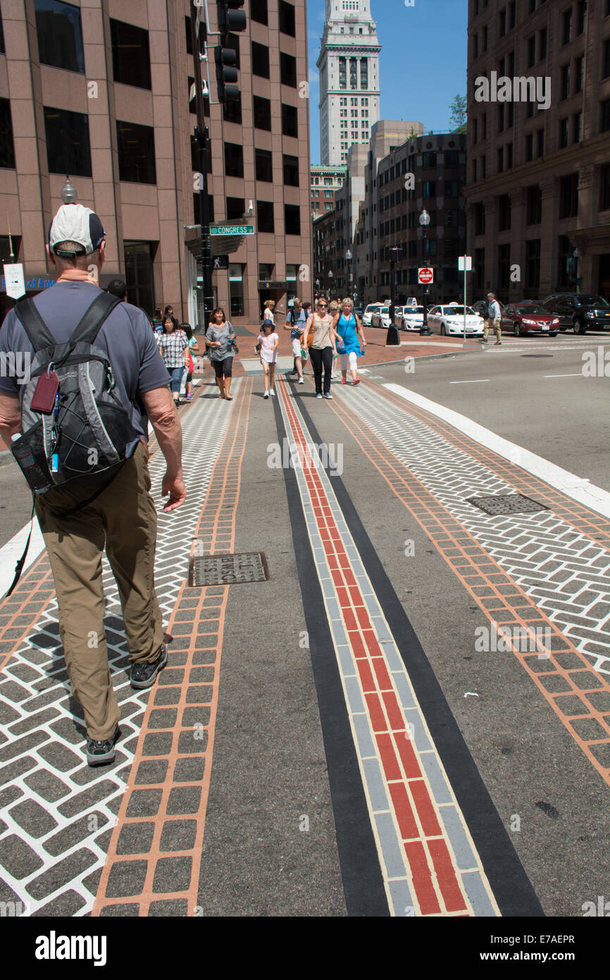 Massachusetts, Boston. Red bricks mark the streets of downtown Boston to allow visitors to follow the Freedom Trail. Stock Photo