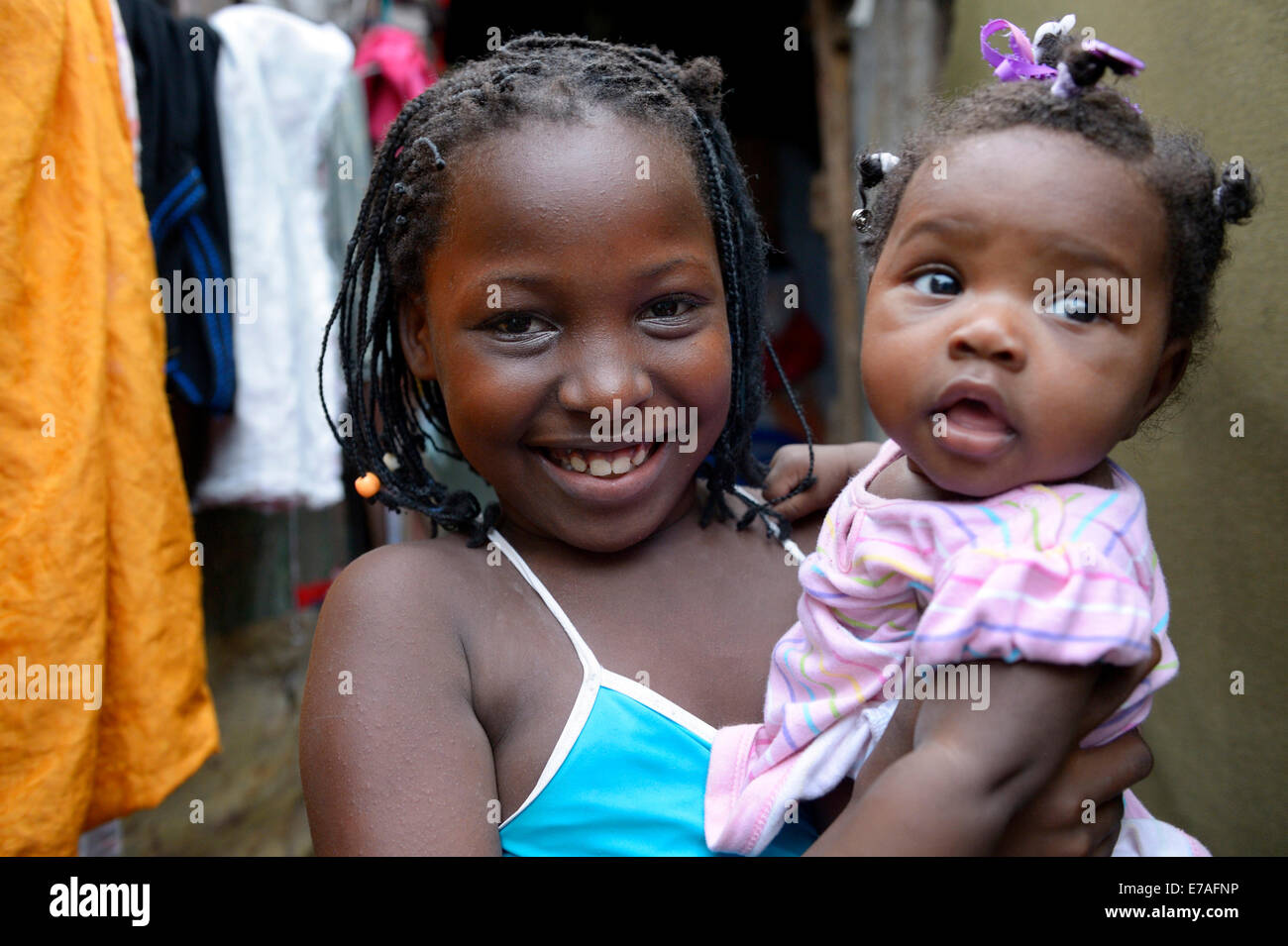 Girls, sisters, 9 years and 1 year, portrait, Camp Icare for earthquake refugees, Fort National, Port-au-Prince, Haiti Stock Photo