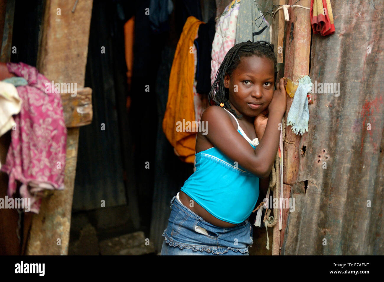 Girl, 9 years, in the entrance of a shack, Camp Icare for earthquake refugees, Fort National, Port-au-Prince, Haiti Stock Photo