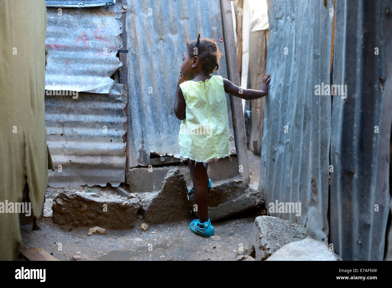 Girl, two years, standing in the doorway of a shack, Camp Icare for earthquake refugees, Fort National, Port-au-Prince, Haiti Stock Photo