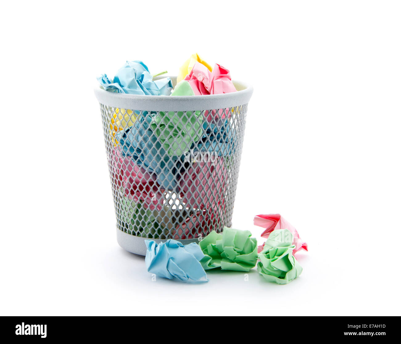 garbage bin with colorful paper waste isolated on white background Stock Photo