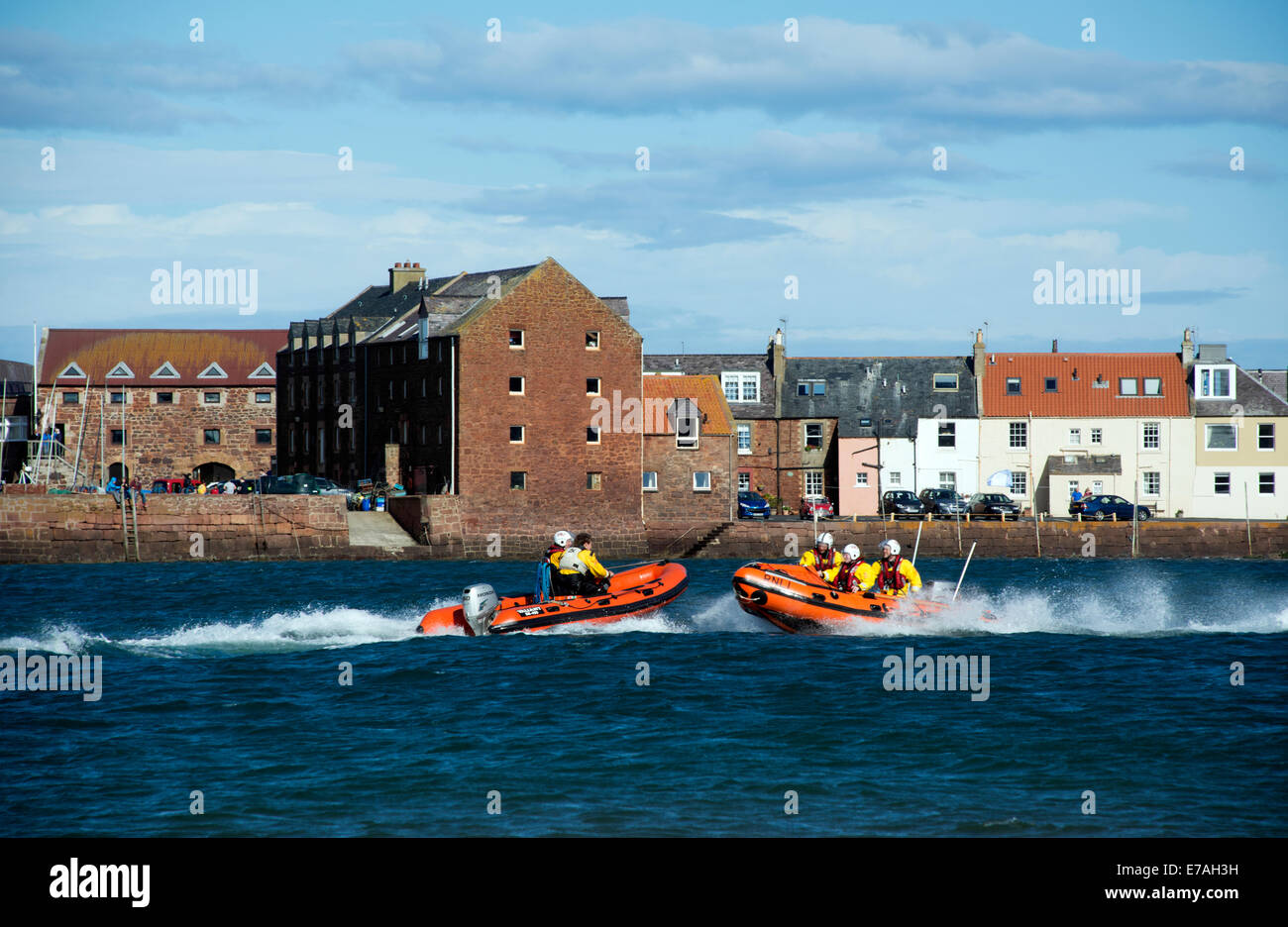 RNLI volunteers in inflatable boats outside North berwick harbour, Scotland. Stock Photo