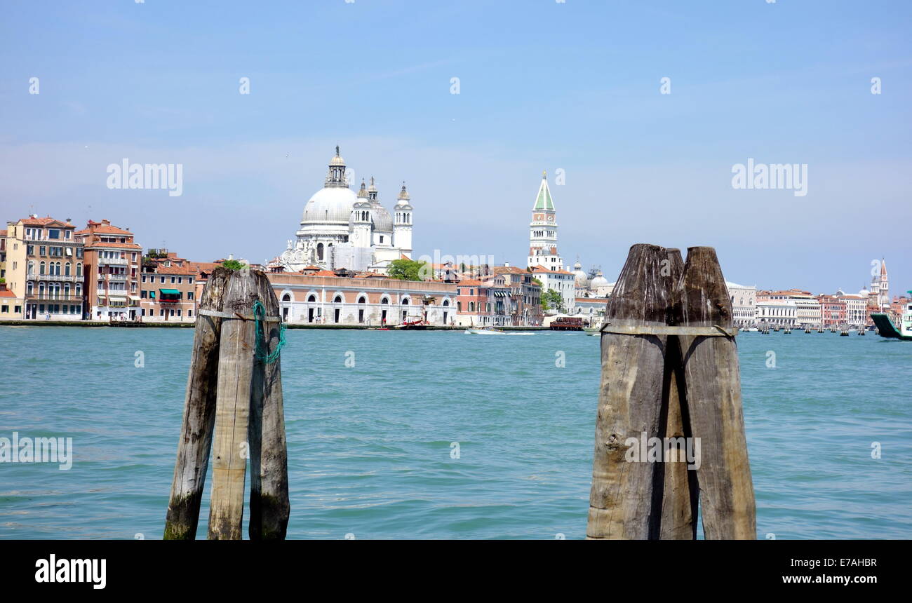 Wooden posts and view of the city in Venice, Italy Stock Photo